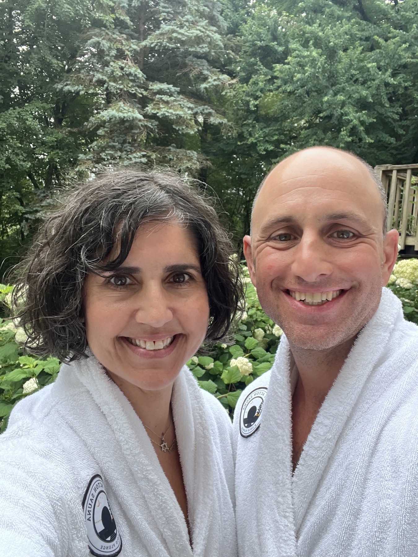 Michelle and Ari, founders of West Acton Sauna, in white robes
