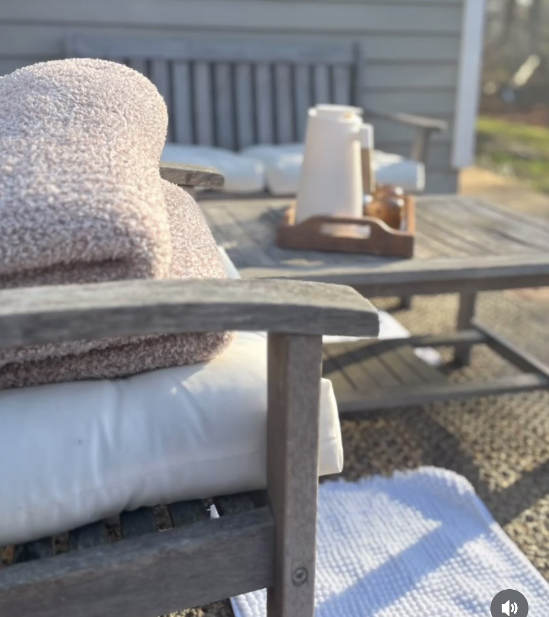 Plush towels and hot tea on the patio in morning light